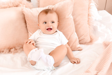 Wall Mural - Portrait of cute little baby on bed at home