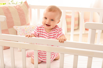 Wall Mural - Portrait of cute little baby in crib at home