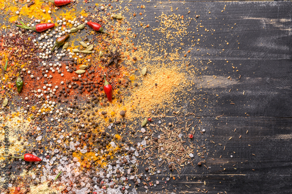 Mix of different spices on dark background