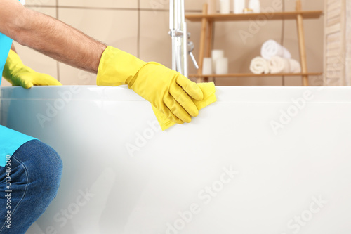 Fotografía Male janitor doing cleanup in bathroom