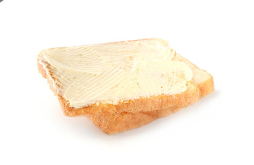 Slices of bread with butter on white background