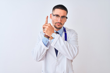 Poster - Young doctor man wearing stethoscope over isolated background Holding symbolic gun with hand gesture, playing killing shooting weapons, angry face