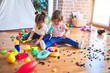 © Krakenimages.com - Adorable toddlers playing meals using plastic food and cutlery toy at kindergarten