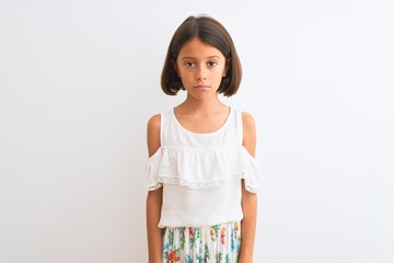 Poster - Young beautiful child girl wearing casual dress standing over isolated white background depressed and worry for distress, crying angry and afraid. Sad expression.