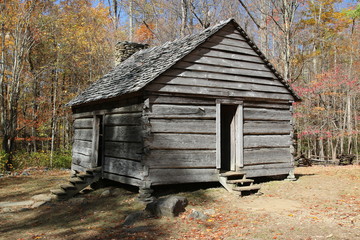 Sticker - an old wooden log cabin in the woods