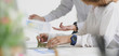 © bongkarn - Cropped shot of young business people discussing on the project together