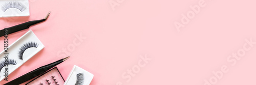 Fotomural Different tools for eye lash extension on trendy pastel pink background