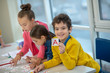 © zinkevych - Smiling schoolboy holding a card with the letter A