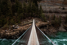 Suspension Bridge Over Rapid River In Montana