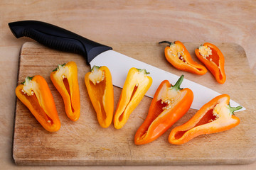 Sticker - Sliced pepper on a wooden board.