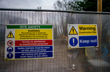  Building Site Entrance. Wire Gate With Warnings And Permission Signs Attached