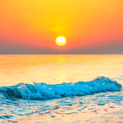 Wall Mural - sunset or sunrise over sea with sun on beautiful dramatic sky