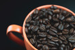 roasted coffee beans in a mug closeup