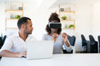 © Mangostar - Excited woman testing VR headset with assistant. Cheerful African American young man and woman testing new device. Technology concept