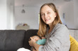 © Mangostar - Positive Caucasian new mom breastfeeding baby. Portrait of young woman and cute little child in home interior. Breastfeeding concept