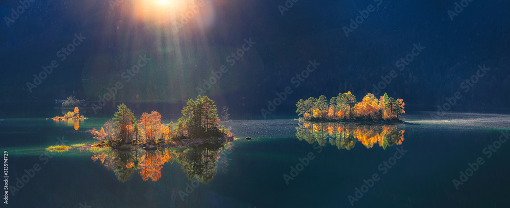 Charming autumn  landscape of islands with pine-trees in the middle of Eibsee lake. - obrazy, fototapety, plakaty 