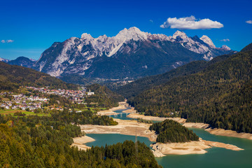 Wall Mural - Panoramic view of lake of Centro Cadore in the Alps in Italy, Dolomites, near Belluno. View of Lake Calalzo, Belluno, Italy. Lake of Centro Cadore in the Alps in Italy, near Belluno.