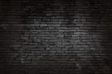 Fototapeta Desenie - Black brick walls that are not plastered background and texture. The texture of the brick is black. Background of empty brick basement wall.