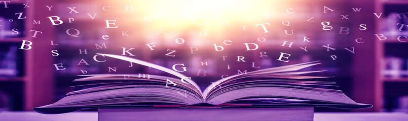 Poster - 	 The concept of education by planting a tree of knowledge in the opening of an old book in the library and the magical magic of light that flies to the destination of success. Beautiful background