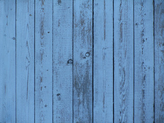 Blue wood texture. Blue grunge background. Vintage indigo board. Blue grunge table. Old painted wooden surface. Cracked peeling paint. Weathered faded planks.