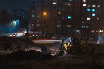 Night view of urban construction works.