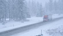 Truck Hauls A Container Across The State Of Washington And Through A Snowstorm.