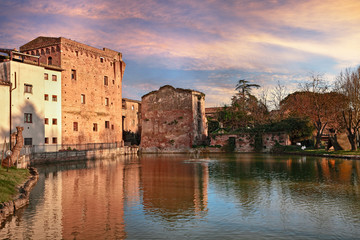 Wall Mural - Monteroni d'Arbia, Siena, Tuscany, Italy: view at sunset of the ancient water mill and the pond 