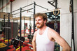 © Cavan Images - Portrait of man at the gym