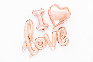 Wall Mural - Pale pink Foil Balloons in the shape of the word 