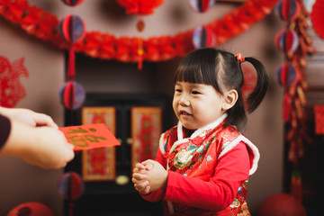 Wall Mural - Chinese baby girl  traditional dressing up with a 