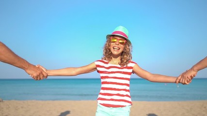 Poster - Happy family having fun on summer vacation. Slow motion