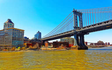 Wall Mural - Manhattan bridge across East River, New York, USA. It is among the oldest in the United States of America. NYC, US. Skyline and cityscape. American construction