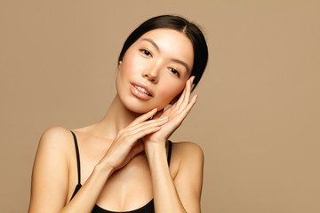 Beauty treatment. Asian young woman portrait. Skin care and spa concept.