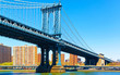 Manhattan bridge across East River, New York, USA. It is among the oldest in the United States of America. NYC, US. Skyline and cityscape. American construction
