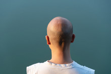 Behind  Portrait Of 40s Bald Asia Man Head With Blue Background