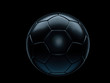Black football or soccer ball against black background