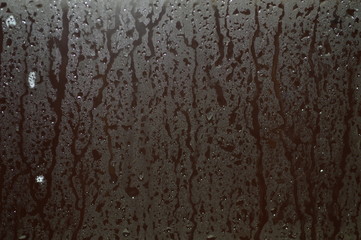 Wall Mural - The surface of the glass in the bathroom with water droplets