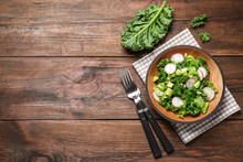 Delicious Kale Salad On Wooden Table, Flat Lay. Space For Text