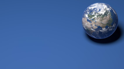 Wall Mural - Earth miniature on a blue background. Elements of this image by Nasa