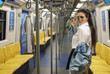 © blackday - Sexy model is posing in carriage of metro train