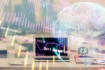 Double exposure of forex chart and work space with computer. Concept of international online trading.