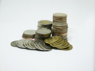 Several Thai coins isolated on white background, heap of coins silver gold, copper thai coin, baht currency.