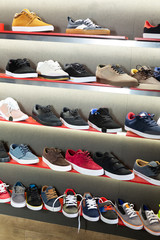 Wall Mural - Casual men shoes on shelves in store