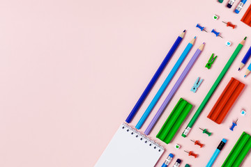 Wall Mural - School and university supplies on pink background. Flat lay, top view, copy space.