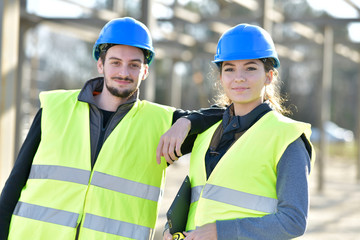 Wall Mural - Portrait of young people apprentice standing on building site