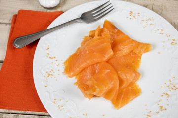 smoked salmon slices on a plate