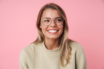 Portrait of beautiful happy woman smiling and looking aside