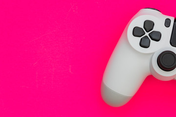 Poster - Video game gaming controller on bright pink color background top view