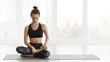 © Prostock-studio - Calm girl preparing for meditating in lotus pose in studio