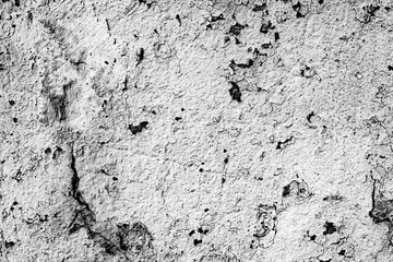 Texture of a concrete wall with cracks and scratches which can be used as a background